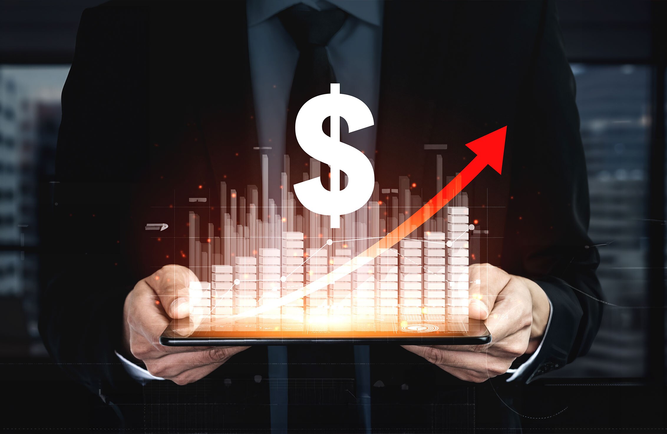 A profit chart on an tablet screen continues to increase