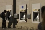 Man uses a Commonwealth Bank ATM