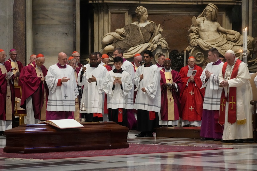 Pope Francis prays during the funeral ceremony for George Pell.