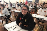 HSC student Rosa-May Williams-Karam sits at her desk, ready to do her maths final.
