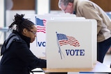 A person at a voting booth in Virginia.