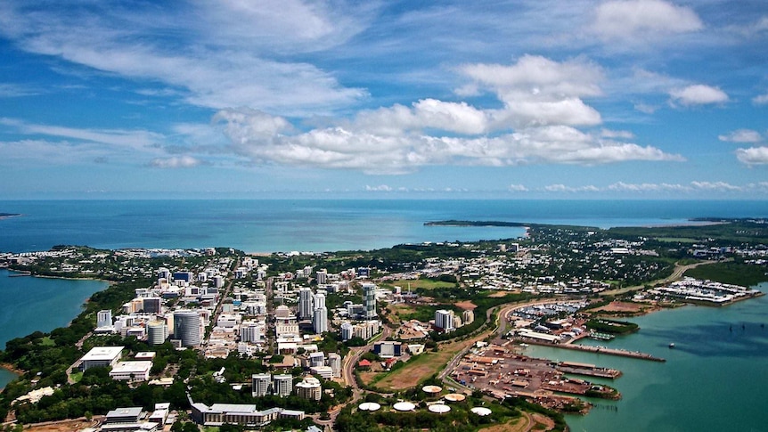A photo of Darwin's skyline, tall buildings with blue sea and skies wrapped around it.