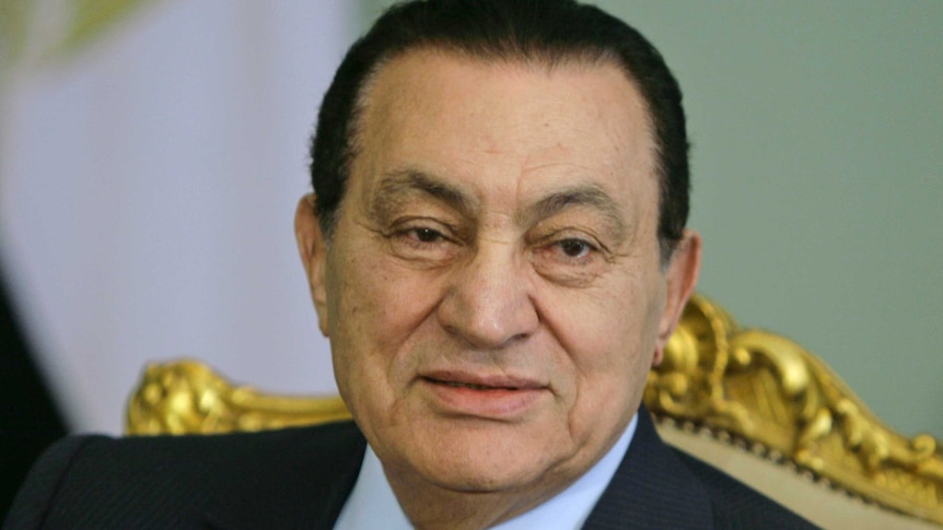 An expressionless Hosni Mubarak.