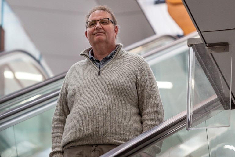 Peter going down an escalator