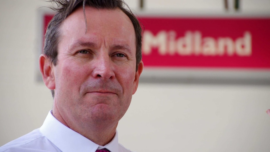 Close-up of WA Opposition Leader Mark McGowan in front of Midland sign.