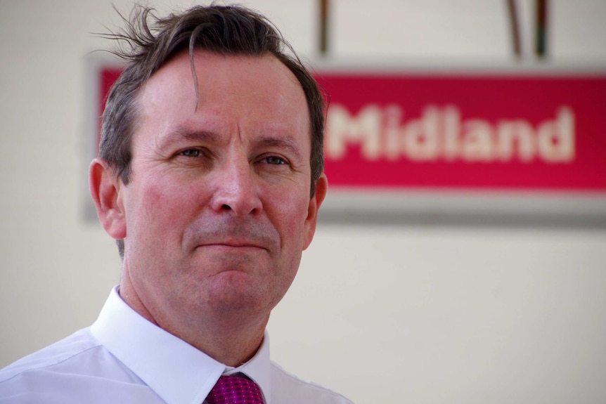 Close-up of WA Opposition Leader Mark McGowan in front of Midland sign.