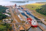 Ships pass through the Gatun locks of the Panama Canal