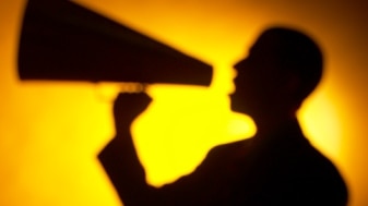 Man with megaphone. (Getty Images: Hemera Technologies)