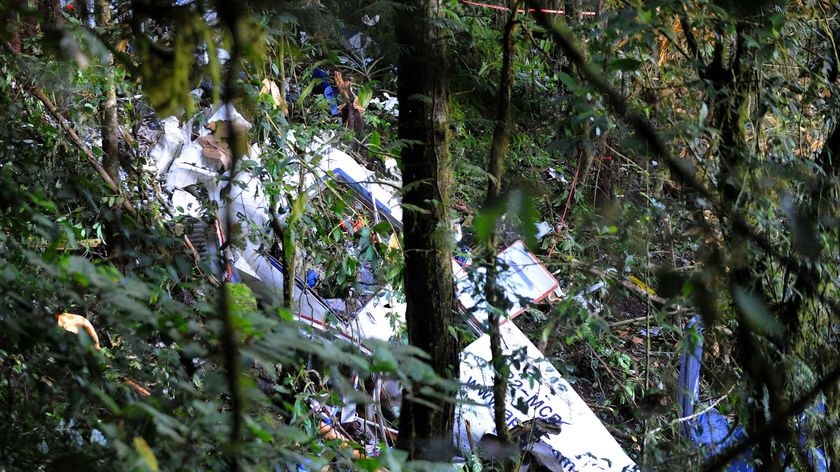 The wreckage of an Airlines PNG Twin Otter aircraft lies in the jungle