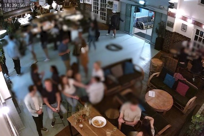 CCTV footage of a busy bar.