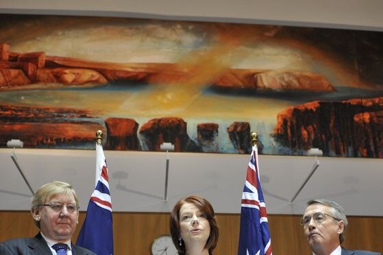Mistake: Julia Gillard announces changes to a mining profits tax with Martin Ferguson and Wayne Swan. (Alan Porritt: AAP)