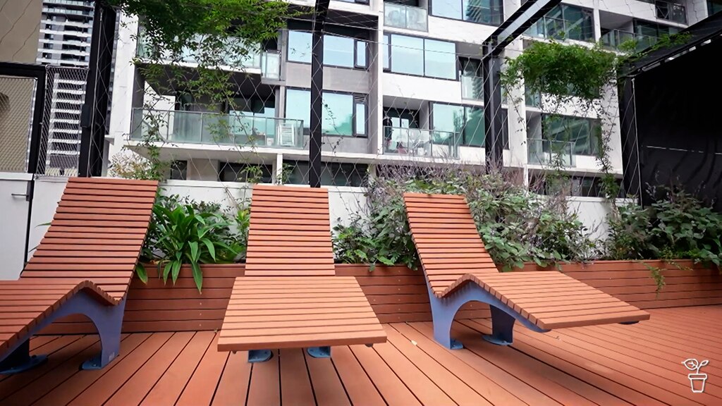 Timber recliners in a city roof-top garden.