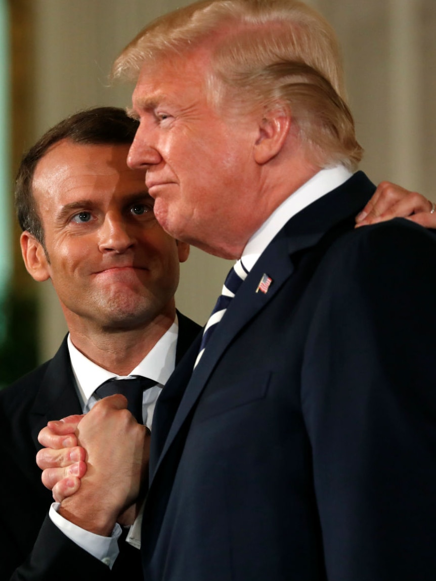 Donald Trump and Emmanuel Macron bro fist shake