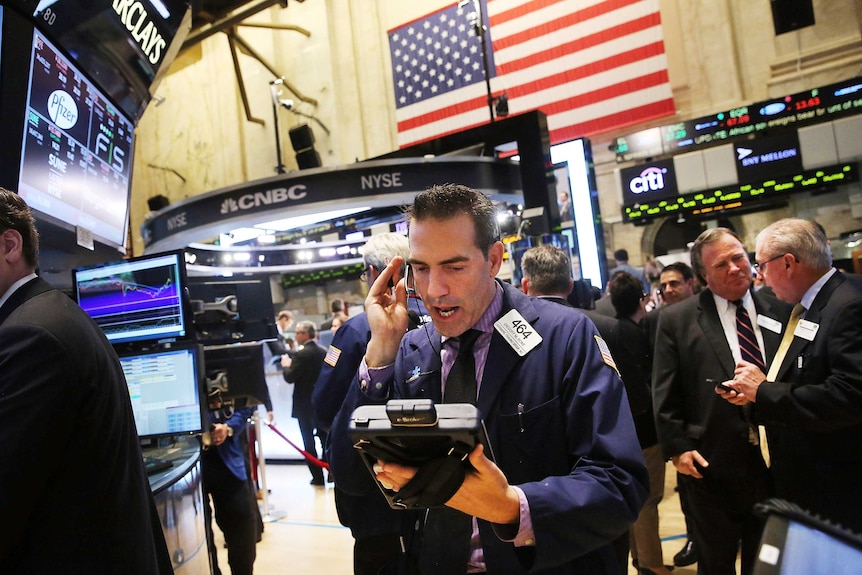 Traders work on the floor of the New York Stock Exchange