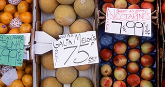 A sign for "melon's" at a greengrocer.