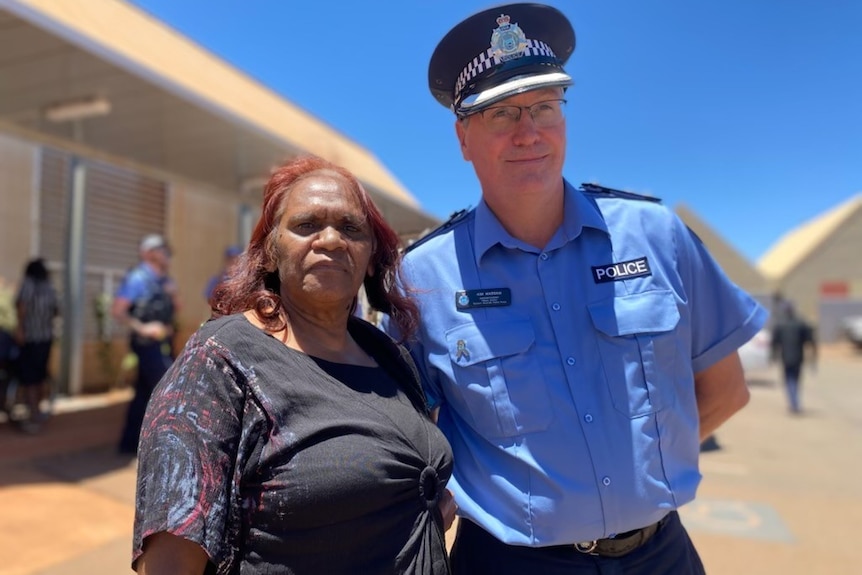 Martu woman Joslyn Mongoo Biljabu standing next to Superintendent Kim Massam at a community meeting in Newman.