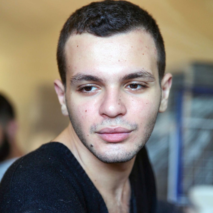 A young man looking thoughtful