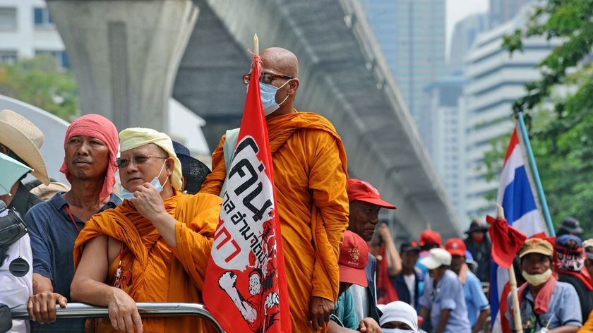 Red Shirt protesters leave their Bangkok CBD camp in a rally