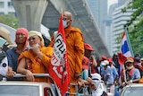 Red Shirt protesters leave their Bangkok CBD camp in a rally