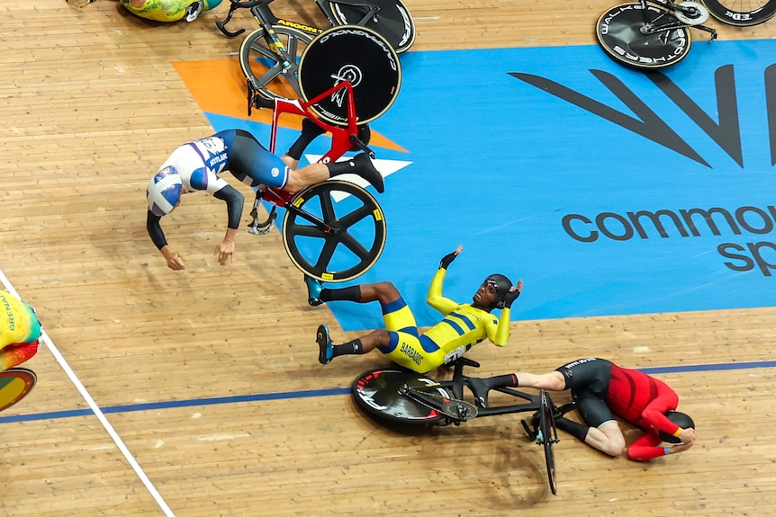 Three riders tumble through the air after a fall