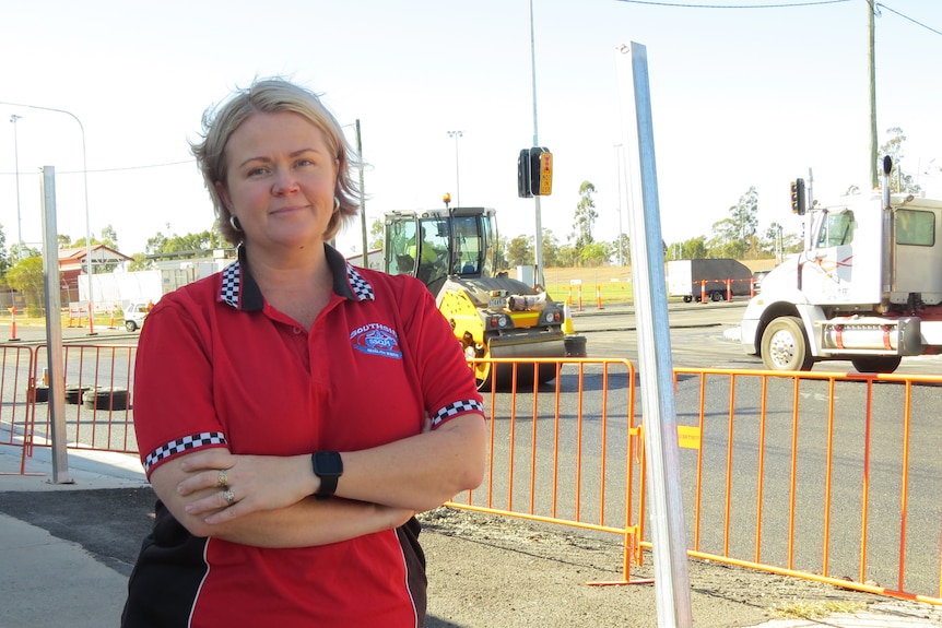 Elisha Beil stands in front of the roadworks outside her shop.