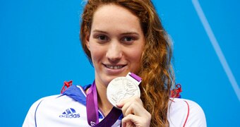 France's Camille Muffat poses with her silver medal on the podium after placing second in the women's 200m freestyle final with an Olympic record during the London 2012 Olympic Games at the Aquatics Centre July 31, 2012.