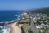 An aerial view of the beach and property, looking south from Coledale beach down the Illawarra coastline.