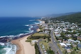 An aerial view of the beach and property, looking south from Coledale beach down the Illawarra coastline.
