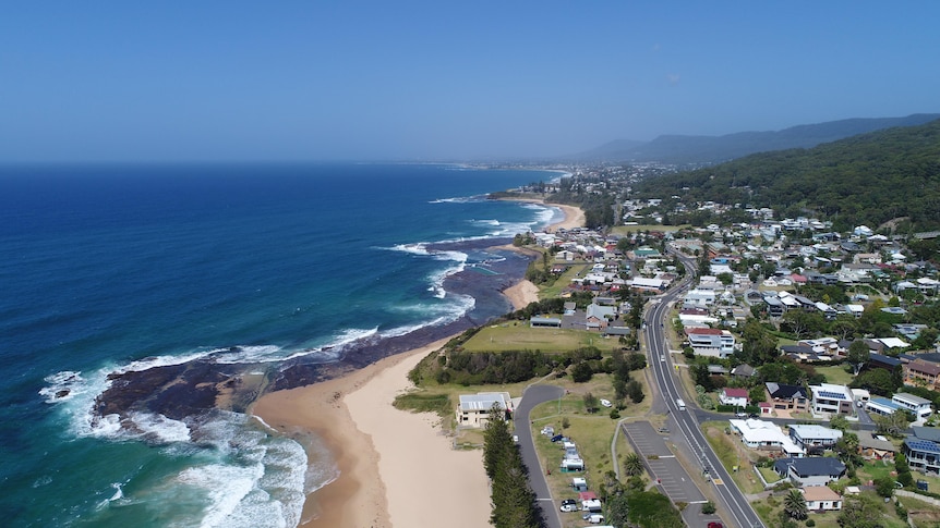 An aerial view of the beach and property, looking south from Coledale beach down the Illawarra coastline.