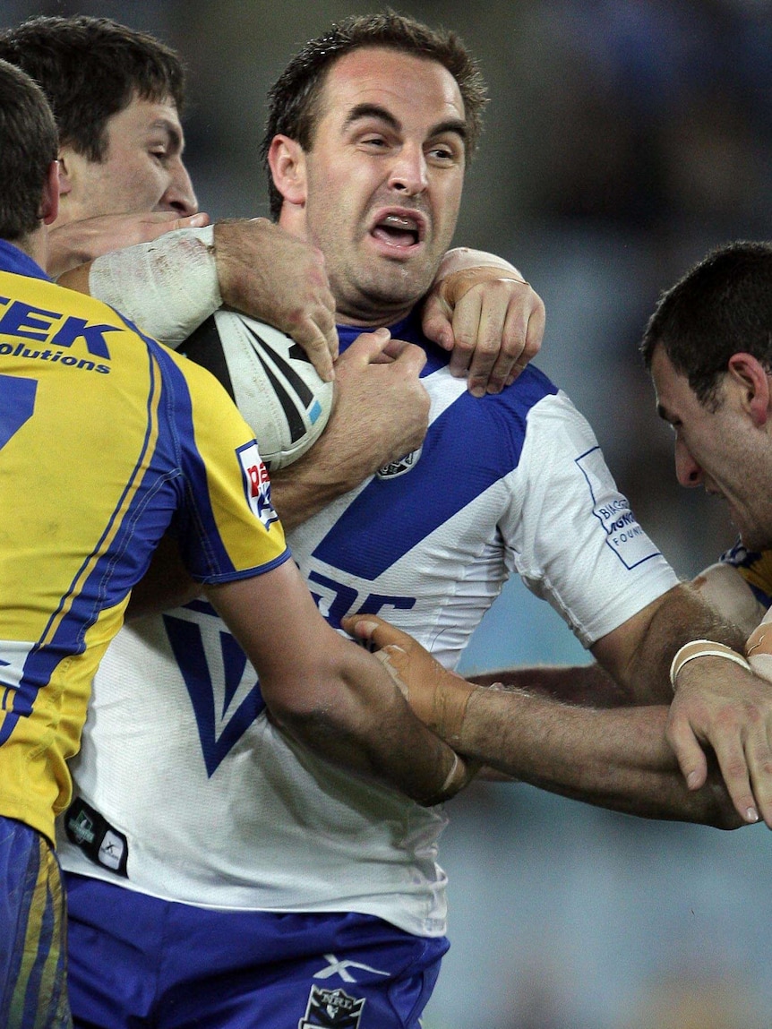 Ryan Tandy is tackled against the Eels.