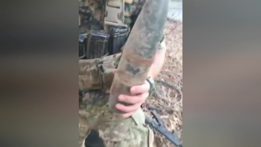 Jamie Williams says this shows him and another foreign fighter disarming a booby trapped IS mine.