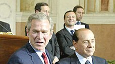US President George W Bush (L) and Italian Prime Minister Silvio Berlusconi swapped praise at a Rome press conference.