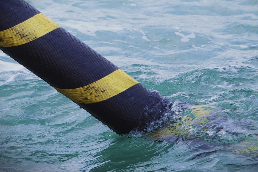 High voltage cable entering water.