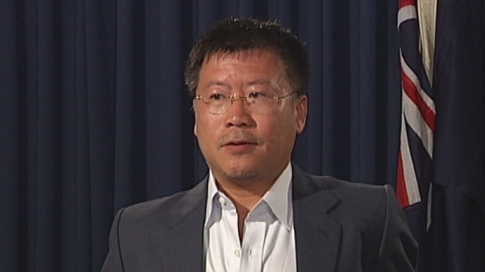 Australian Ilmenite Resources owner Jerry Ren at the podium during the announcement of the mine agreement in 2013.