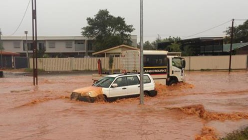 Vehicles on flooded street