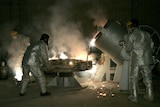 Technicians work at a uranium processing site in Isfahan, Iran