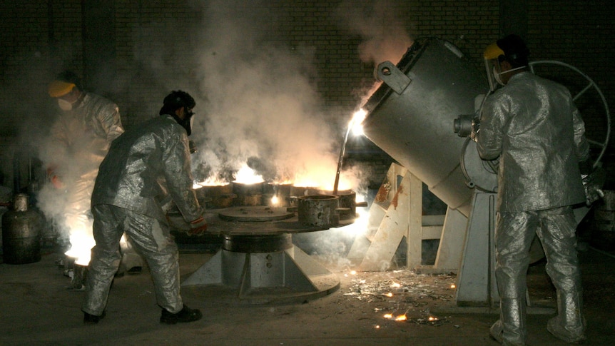 Technicians work at a uranium processing site in Isfahan, Iran