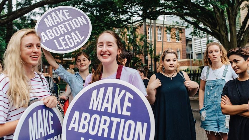 Young women attend a pro-choice rally in Brisbane in May, 2016.