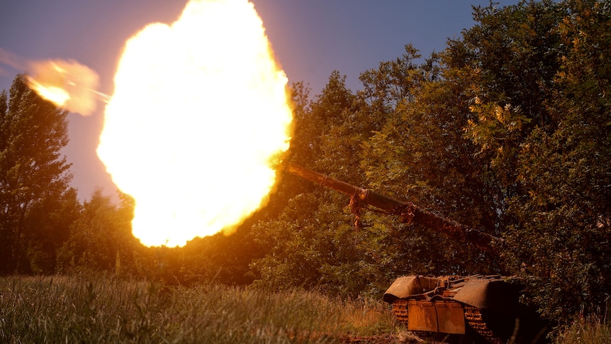 A tank is seen firing a large ball of fire.
