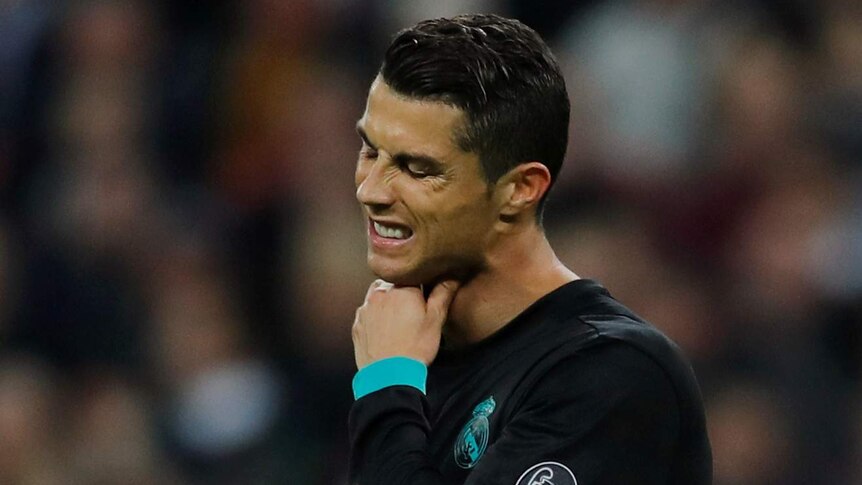 Cristiano Ronaldo holds his chin and looks upset after Real Madrid lost to Tottenham.