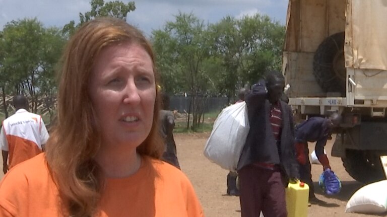 Carly Sheehan speaks to the ABC as the UNHCR delivers supplies.