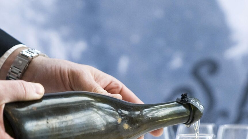 A man pours a 200-year-old champagne