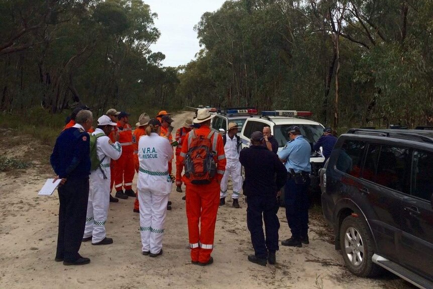 Searchers gather during a search for a 69-year-old bushwalker.