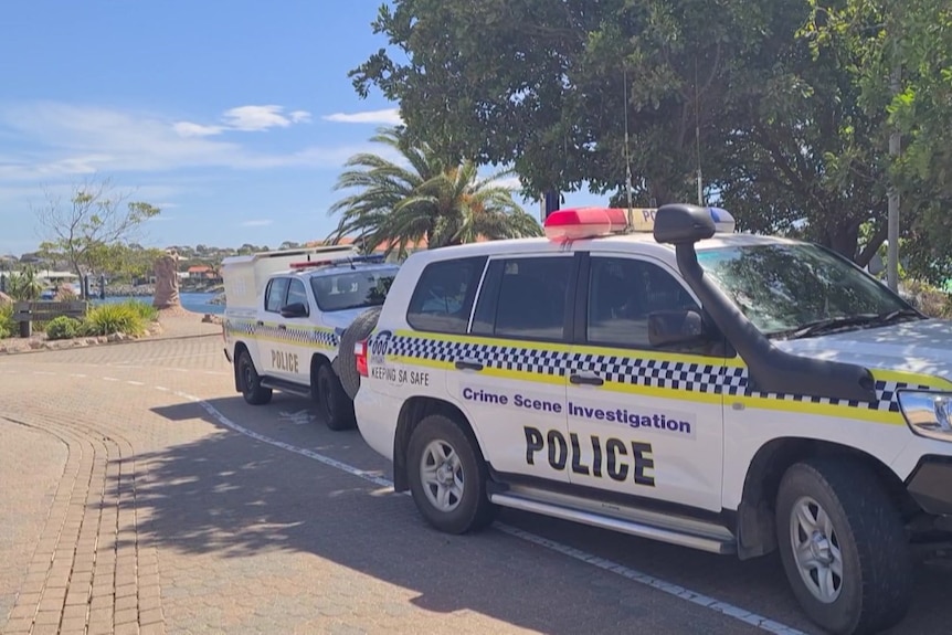 Two police cars are parked at the marina in Port Lincoln.