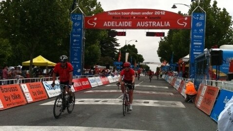 Cyclists cross the line at Tanunda in SA in TDU charity ride for Cancer Council, January 20 2012