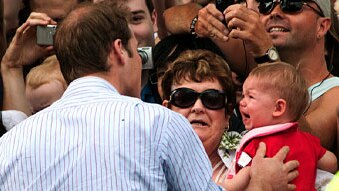 Prince William doesn't quite pull off the classic baby shot in Melbourne (Wolf Cocklin, ABC News)