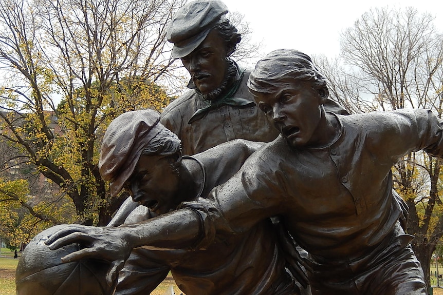 A brass statue of Tom Wills outside the MCG.