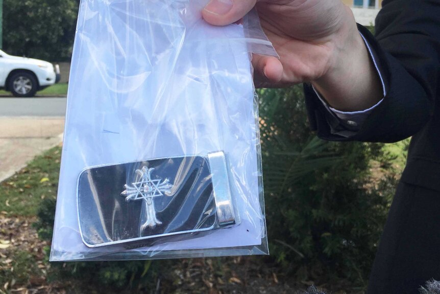 A belt buckle found at the scene of the assault