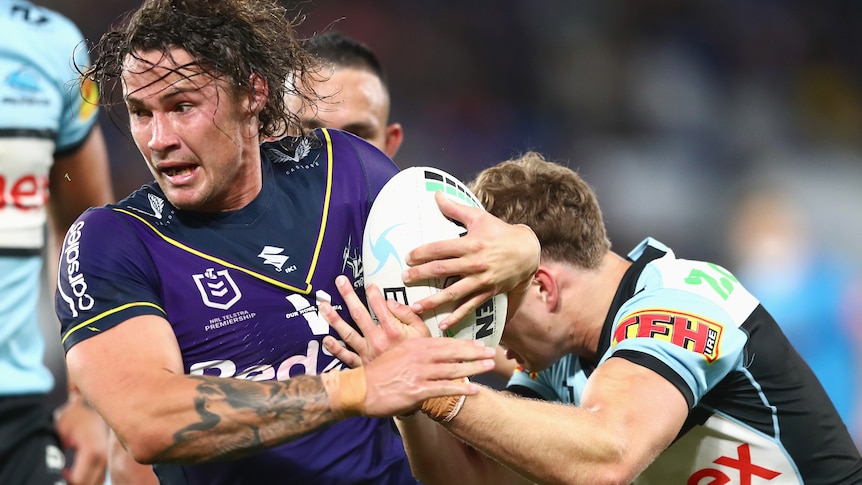 Nicho Hynes is tackle by a Cronulla defender 