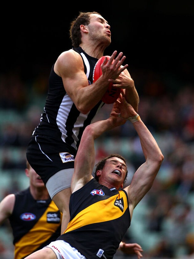 Pies fly high: Brent Macaffer marks over the top of Andrew Collins.